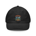 Retro mountain trail badge design on a Wander Wild Co vintage dad cap