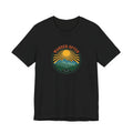 Retro wanderlust badge graphic on a black Wander Wild Co vintage classic tee